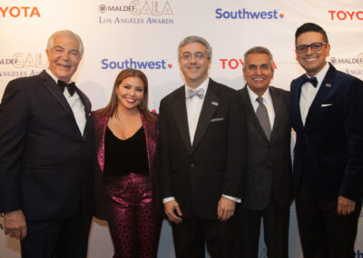 Group of people dressed professionally standing in front of a banner. Names left to right: Alex Nogales, Justina Machado, Thomas A. Saenz, Richard Alatorre, and Raul Lomeli-Azoubel